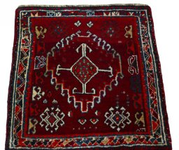Surface texture of 2000s Shiraz rug with natural Wool and intricate pattern