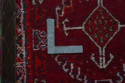 Backside of handmade 2000s Shiraz rug showing knot structure and weave density