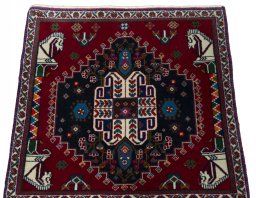 Surface texture of 2000s Shiraz rug with natural Wool and intricate pattern