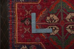 Backside of handmade 2000s Shiraz rug showing knot structure and weave density