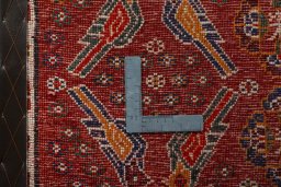 Backside of handmade 2000s Shiraz rug showing knot structure and weave density