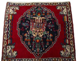 Surface texture of 2000s Shiraz rug with natural Wool and intricate pattern