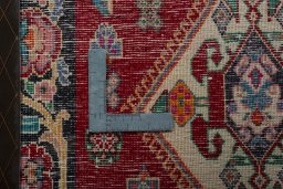 Backside of handmade 2000s Shiraz rug showing knot structure and weave density