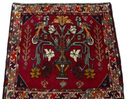 Surface texture of 2000s Shiraz rug with natural Wool and intricate pattern