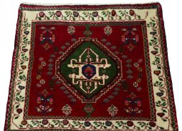 Surface texture of 2000s Shiraz rug with natural Wool and intricate pattern