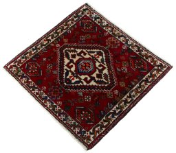 Corner detail of 2000s Shiraz rug showing border pattern and Wool pile