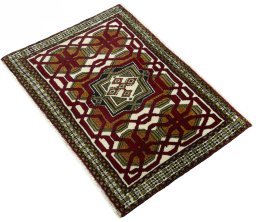 Corner detail of 2000s Shiraz rug showing border pattern and Wool pile