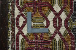 Backside of handmade 2000s Shiraz rug showing knot structure and weave density