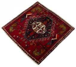 Corner detail of 2000s Shiraz rug showing border pattern and Wool pile