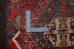 Backside of handmade 2000s Shiraz rug showing knot structure and weave density