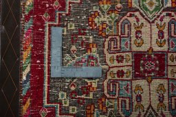 Backside of handmade 2000s Shiraz rug showing knot structure and weave density