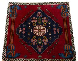 Surface texture of 2000s Shiraz rug with natural Wool and intricate pattern