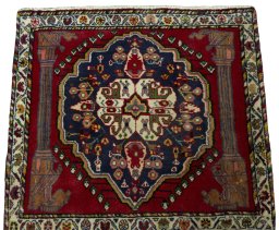 Surface texture of 2000s Shiraz rug with natural Wool and intricate pattern