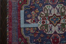 Backside of handmade 2000s Shiraz rug showing knot structure and weave density