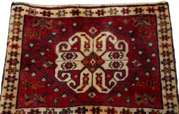 Surface texture of 2000s Shiraz rug with natural Wool and intricate pattern