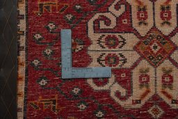 Backside of handmade 2000s Shiraz rug showing knot structure and weave density