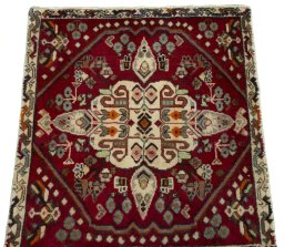Surface texture of 2000s Shiraz rug with natural Wool and intricate pattern