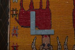 Backside of handmade 2000s Shiraz rug showing knot structure and weave density