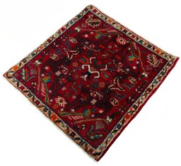 Corner detail of 2000s Shiraz rug showing border pattern and Wool pile