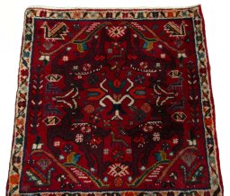 Surface texture of 2000s Shiraz rug with natural Wool and intricate pattern