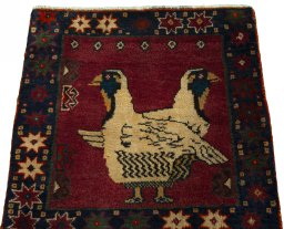 Surface texture of 2000s Shiraz rug with natural Wool and intricate pattern