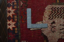 Backside of handmade 2000s Shiraz rug showing knot structure and weave density