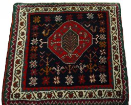 Surface texture of 2000s Shiraz rug with natural Wool and intricate pattern