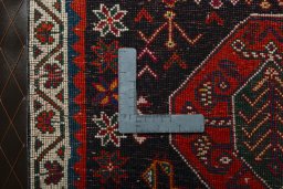 Backside of handmade 2000s Shiraz rug showing knot structure and weave density