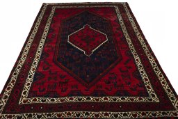 Surface texture of 2000s Shiraz rug with natural Wool and intricate pattern