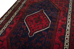 Backside of handmade 2000s Shiraz rug showing knot structure and weave density