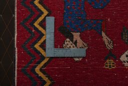 Backside of handmade 2000s Shiraz rug showing knot structure and weave density