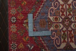 Backside of handmade 2000s Shiraz rug showing knot structure and weave density