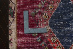 Backside of handmade 2000s Shiraz rug showing knot structure and weave density