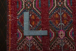 Backside of handmade 2000s Shiraz rug showing knot structure and weave density