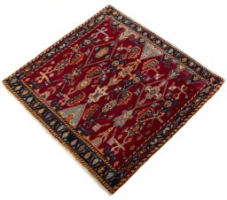 Corner detail of 2000s Shiraz rug showing border pattern and Wool pile