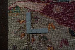 Backside of handmade 2000s Shiraz rug showing knot structure and weave density