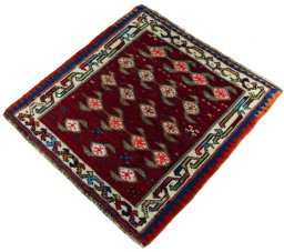 Corner detail of 2000s Shiraz rug showing border pattern and Wool pile