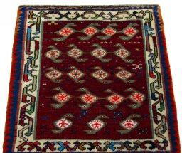 Surface texture of 2000s Shiraz rug with natural Wool and intricate pattern