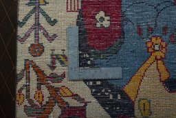Backside of handmade 2000s Shiraz rug showing knot structure and weave density