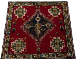 Surface texture of 2000s Shiraz rug with natural Wool and intricate pattern