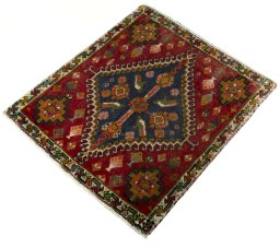 Corner detail of 2000s Shiraz rug showing border pattern and Wool pile