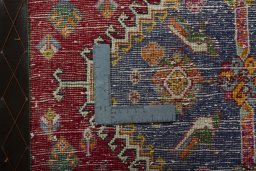Backside of handmade 2000s Shiraz rug showing knot structure and weave density