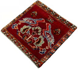 Corner detail of 2000s Shiraz rug showing border pattern and Wool pile