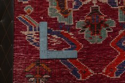 Backside of handmade 2000s Shiraz rug showing knot structure and weave density