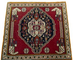 Surface texture of 2000s Shiraz rug with natural Wool and intricate pattern