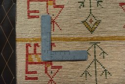 Backside of handmade 2000s Shiraz rug showing knot structure and weave density