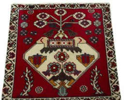 Surface texture of 2000s Shiraz rug with natural Wool and intricate pattern