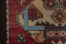 Backside of handmade 2000s Shiraz rug showing knot structure and weave density