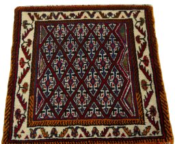 Surface texture of 2000s Shiraz rug with natural Wool and intricate pattern