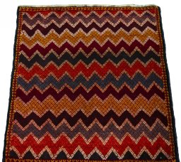 Surface texture of 2000s Shiraz rug with natural Wool and intricate pattern
